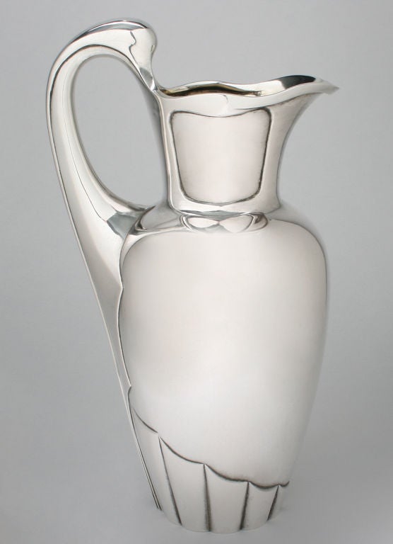 This is a fabulous pitcher, having a subtle bat wing motif.  It was executed by Bernard Hertz and assayed by Christian Frederik Heise.