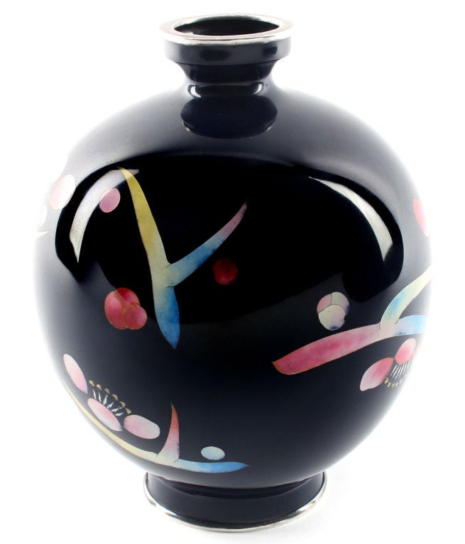 This is a modernist piece of cloisonné, having abstracted cherry blossoms as the main decorative element.
