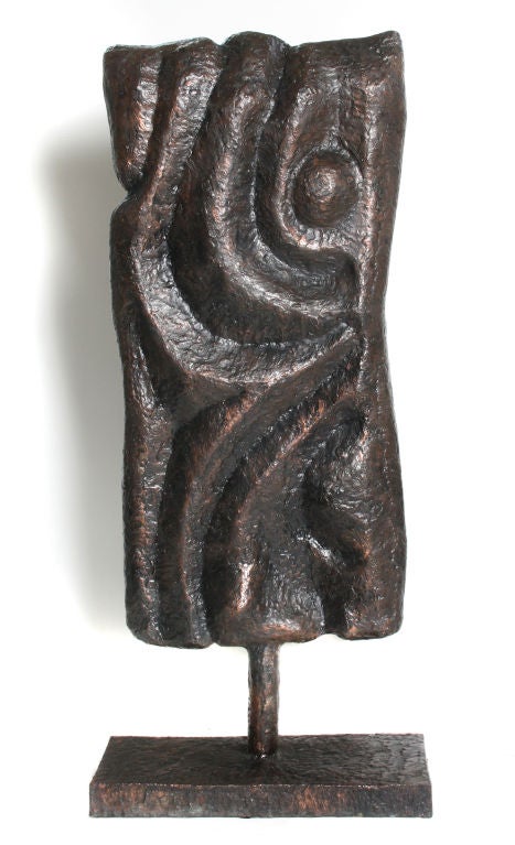 This sculpture's wavy lines looks great from either side. Made of patinated copper, it is lightweight and easy to move.