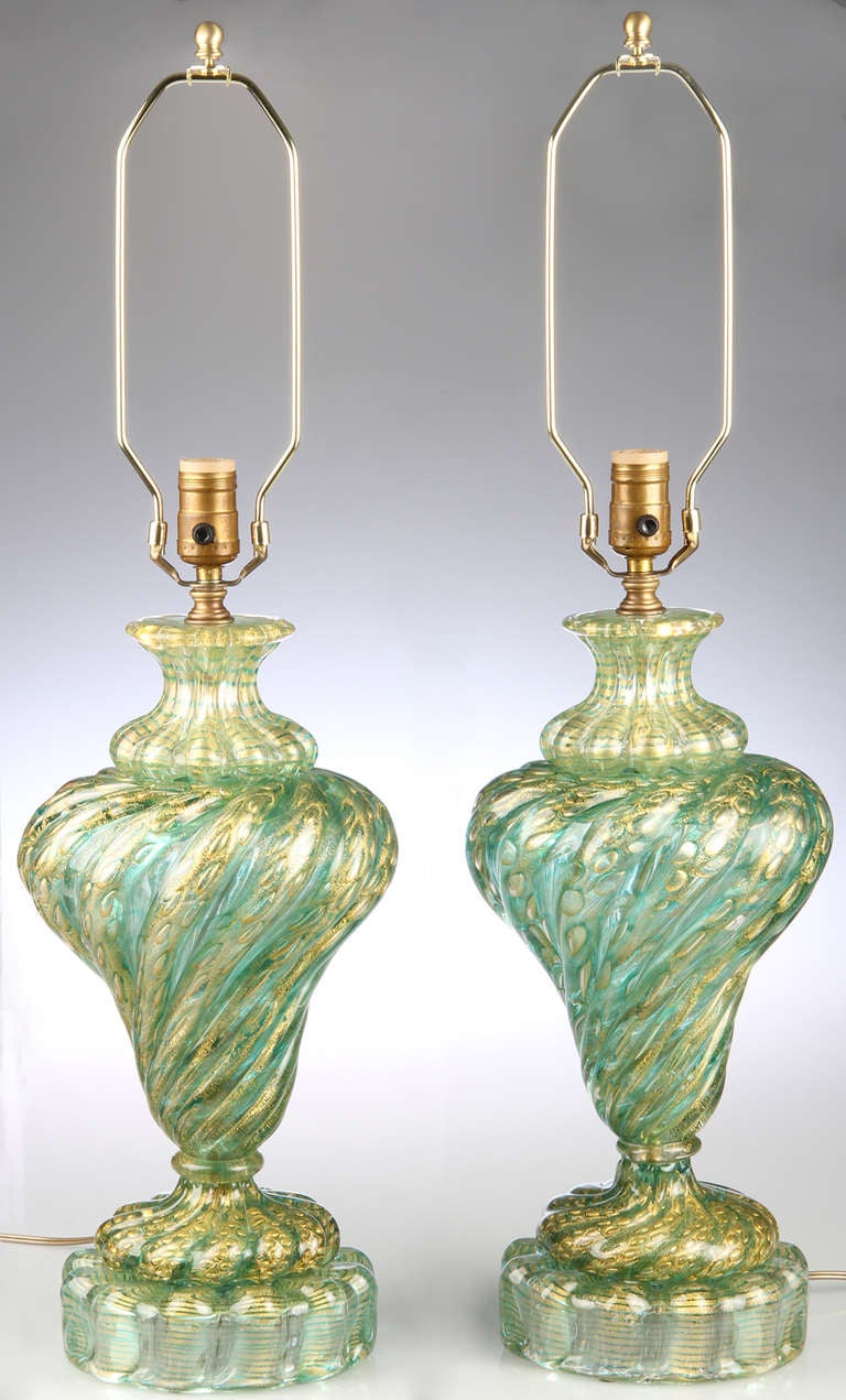 These are great pieces of glass...something we don't come across often.  The color is unusual and beautiful. The height form base to top of socket is 20. 