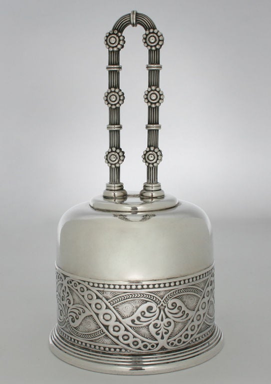 This is a great example of early Tiffany. This is a  dinner bell with wonderful details in the bell and handle.