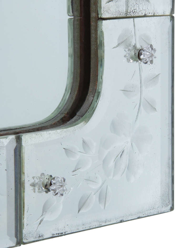 This is nicely rendered mirror featuring a stylized floral border and bird in a  Queen Anne style.
