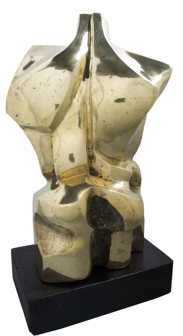 This is a strong masculine sculpture, very cubist in nature.
The piece is signed B. Idrissa and dated 1986.