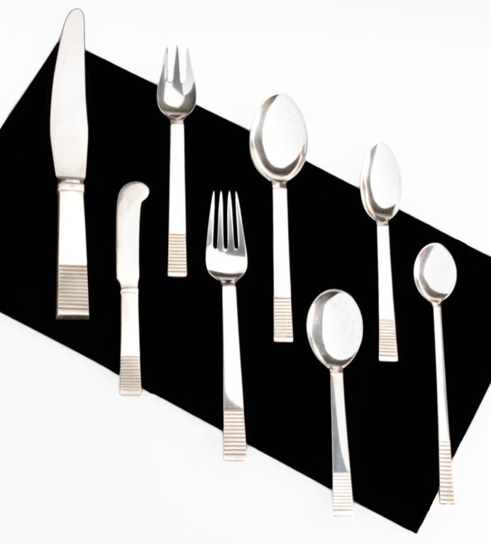 This is a beautiful and seemingly barely used set and one of Jensens most famous and rare designs, Parallel.  Designed by Oscar Gunlach Pedersen, it was produced between 1933 and 1944. An eight piece place setting for twelve, additional pieces