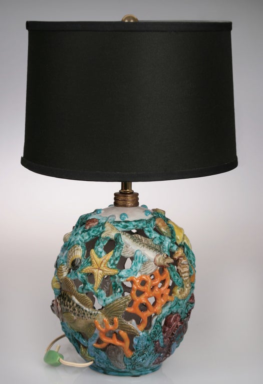 This is a fabulous lamp for those lovers of all things undersea. It is handpainted as well as pierced, creating a floating effect. The ceramic base alone measures 10
