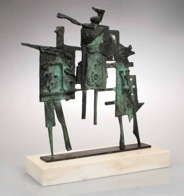 This is a strong sculptural grouping of three figures.  The patina on this piece is outstanding. Titled 