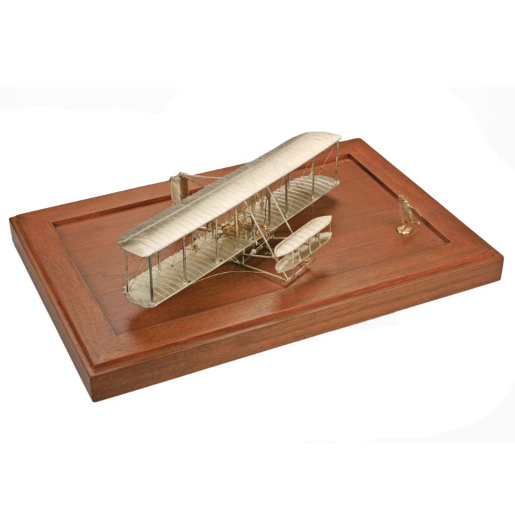 This is a scale model of the famous Wright Flyer, which made the first powered flight at Kitty Hawk in 1903. It is detailed and meticulously recreated in sterling silver.  It is from an unnumbered edition of 1000
*Measurements*
The sterling plane