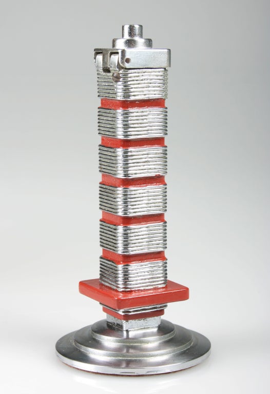 This lighter is modeled after the Frank LLoyd Wright designed Research Tower in Racine, Wisconsin.  There were approximately 5000 of these made, and most were given to the higher ups that worked at Johnson Wax, as Christmas presents between 1947 and