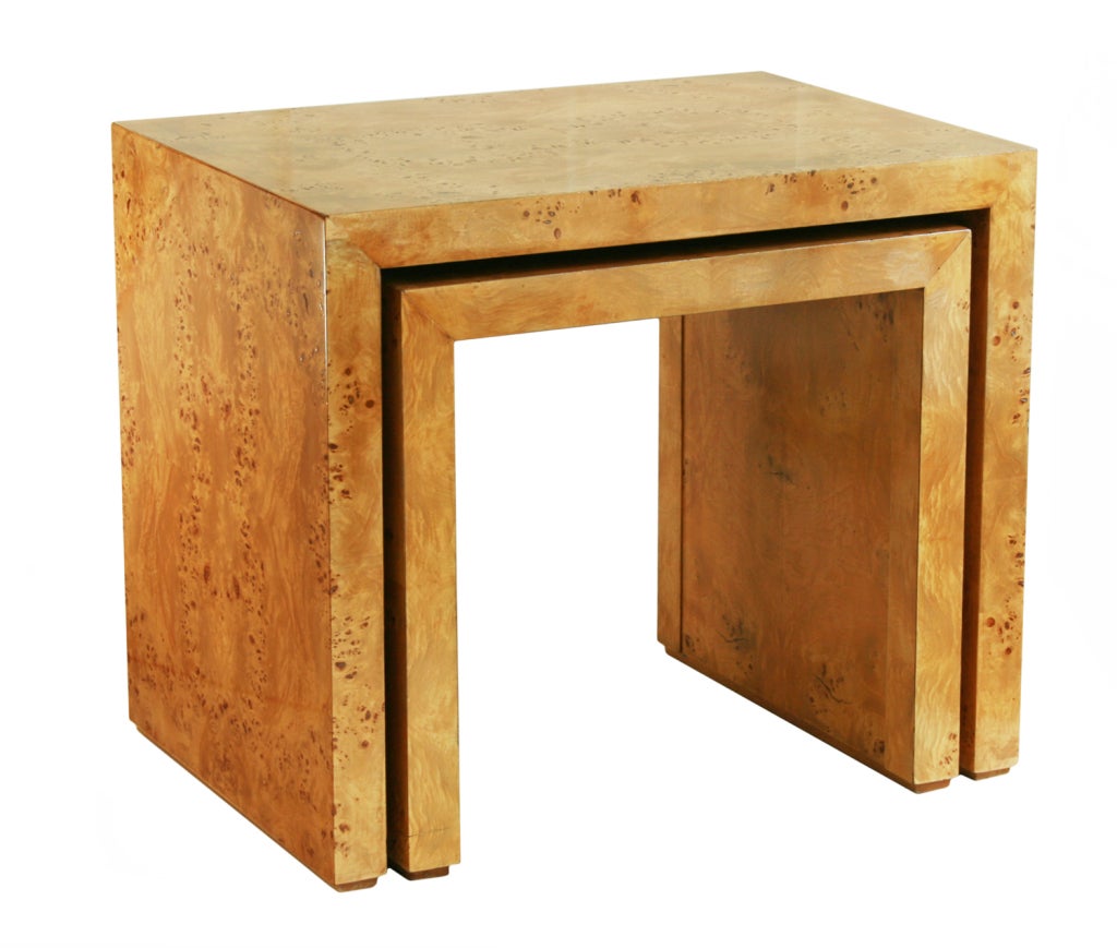 These beautiful nesting tables  have a wonderful burled veneer. The smaller of the tables measures 22 1/2 