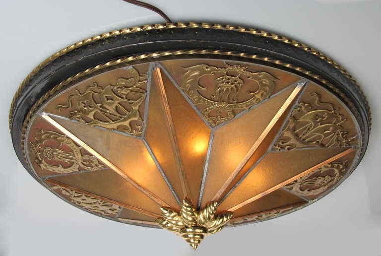 This is a large and unusual Art Deco ceiling fixture with star patterned glass and bronze medallions.  The fixture came out of a movie theater in Chicago and the bronze work looks like Oscar Bach.  This  flush mount fixture could also be suspended