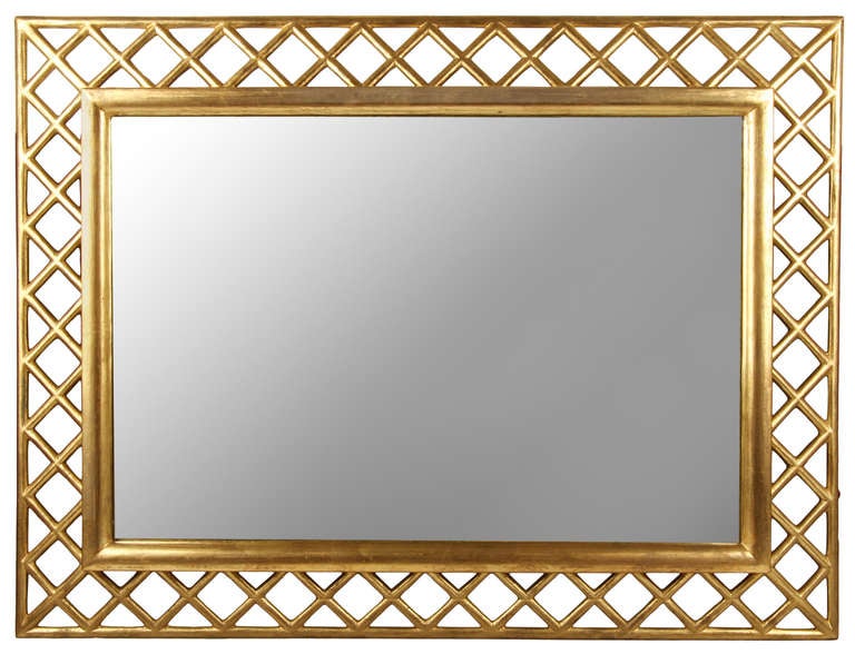 A pair of mirrors with a heavy gilding.  These can be mounted vertically or horizontally by re positioning the hardware.