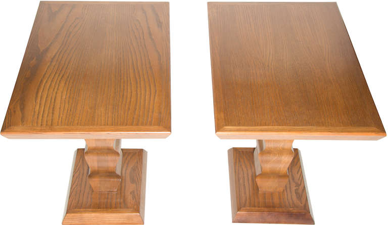 These are an interesting pair of side tables by Karpen of California.
The bases are unusual undulating carved wood.