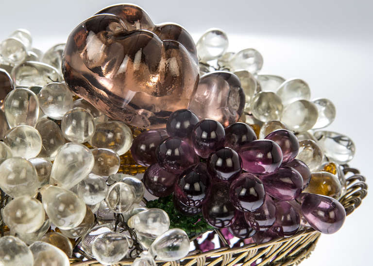 This is a beautiful lamp accented with purple fruit, overflowing grapes and a purple glass beaded basket.  There are underlying golden yellow and green beads which emulate the colors of vines and leaves.  Very nice detail in this piece.