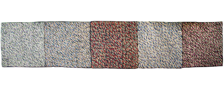 This is an unusual runner consisting of five hooked together rugs of varying colors in a repetitive optical  pattern.