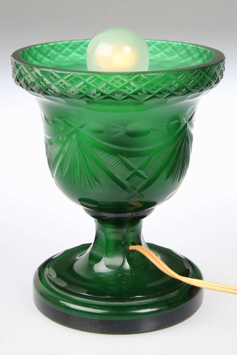 These are quite beautiful with a wonderful assortment of richly  colored glass fruit and leaves. The vases are a deep green cut glass.

Pair of lamps each 12 inches tall x 8 1/2 inches in diameter
The height of the green bowl is 7 1/2 inches
