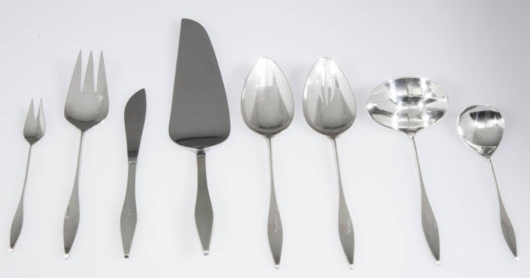 This modernist set consists of 12, 6 piece place settings and 8 additional serving pieces. Another great design by renowned  silversmith John Prip.