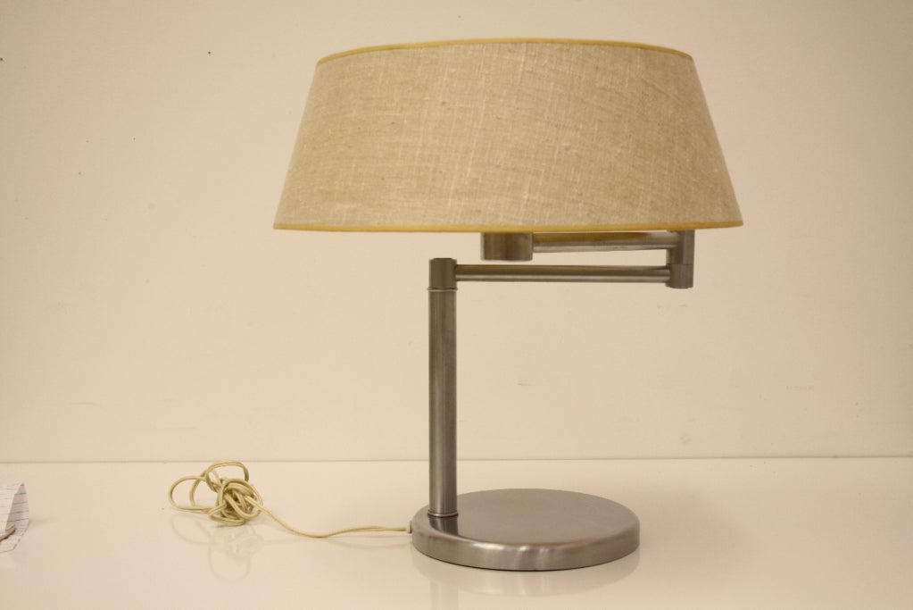 Swing arm Nessen desk lamp in brushed nickel with original shade. Pair also available. Price per lamp.