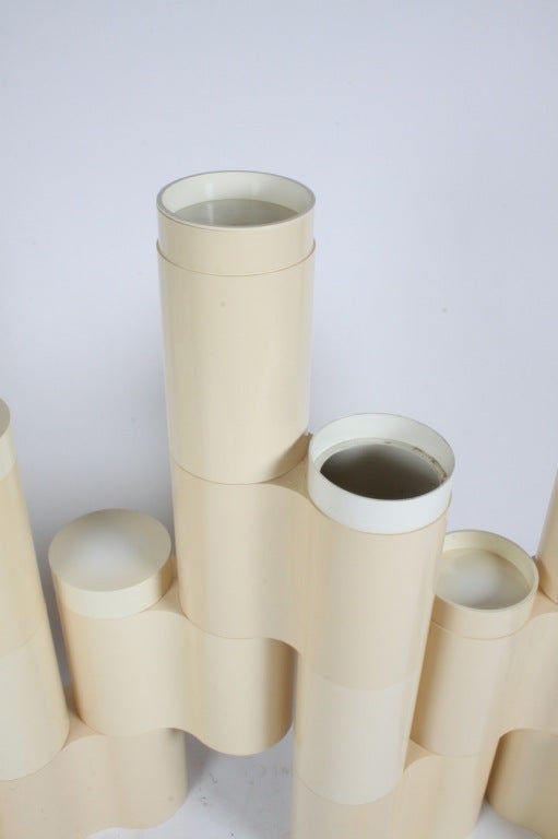 Plastic modular cylindrical forms make a sculptural wall or screen, Pierluigi Spandolini for Kartell, each modila element has a 7