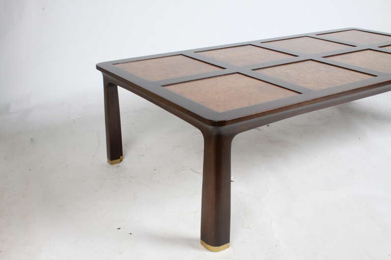 Mid-Century Modern, Rarely seen Edward Wormley rectangular walnut frame coffee table in a dark brown finish with inset Carpathian elm square top and sculpted legs with heavy brass sabots, Dunbar labels, model number 6007. Refinished. Ed Wormley, is