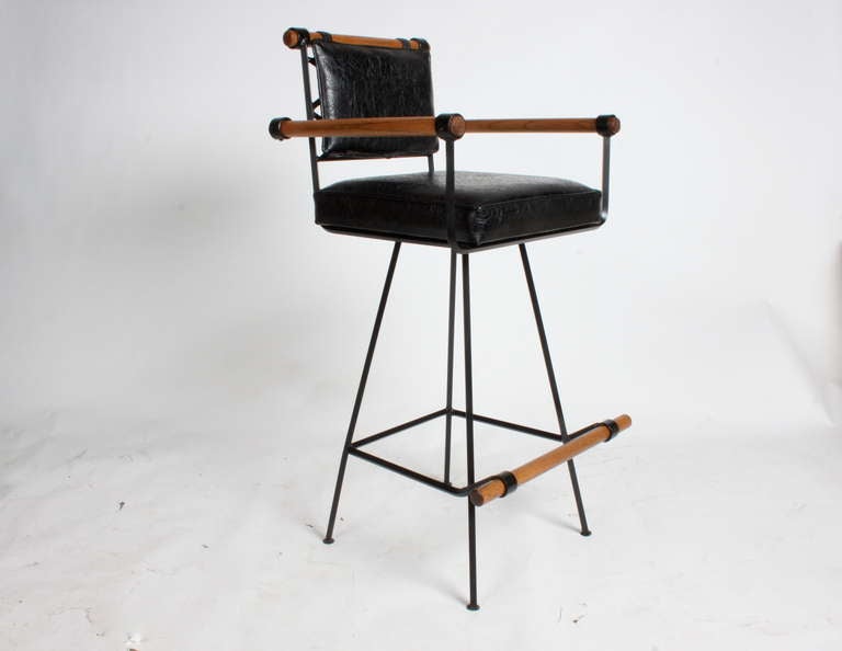 pair of swivel barstools in iron & wood with leatherette seat  in the style of Cleo Baldon for Terra. Arm height is 35.5
