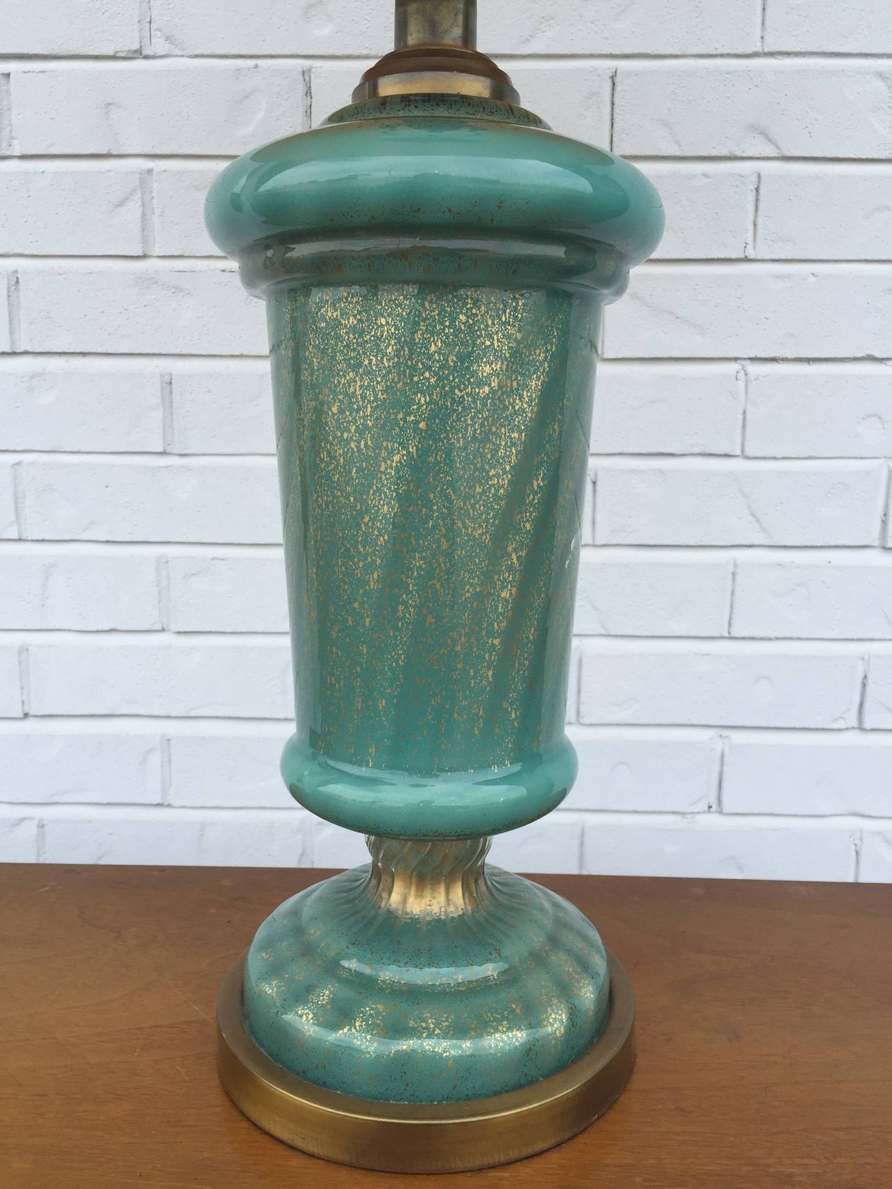 Gorgeous aqua Murano glass lamp with gold flecks in neoclassical urn shape and brass base. Paul Hansen label, shade not included.
