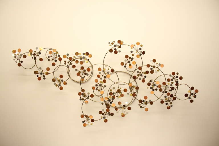 Curtis Jere wall sculpture in mixed metals with gilting to back of rings, signed C. Jere & dated 1978, 61