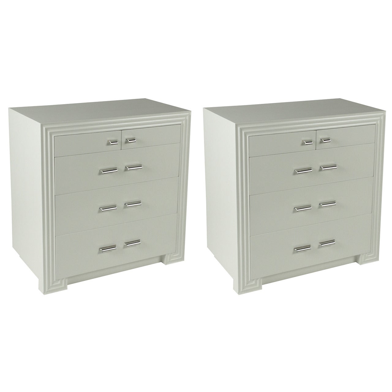 Pair of classical modern matching chests designed by St. Louis Modernist Architect Meyer H. Loomstein and built by his furniture studio Guild Craftsmen in the 1940s. Shown in white lacquer, outer frame has fluted border, similar to a Greek key form