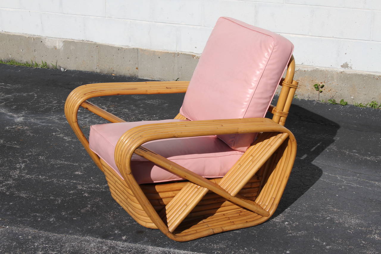 Paul Frankl style rattan or bamboo chairs with pretzel profile, loose seat cushions on sculptural bamboo frame. 

Measures: 34 W x 36 D x 34 H, seat 15.5 H.
Pair-Original touched up, should reupholster.