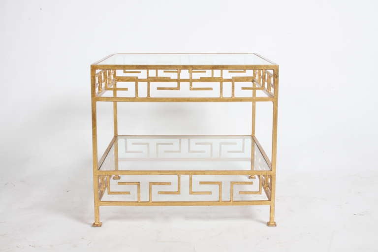 Gilt iron side tables with Greek Key motif on sides, glass top and lower shelf. Lower  shelf at 6.5