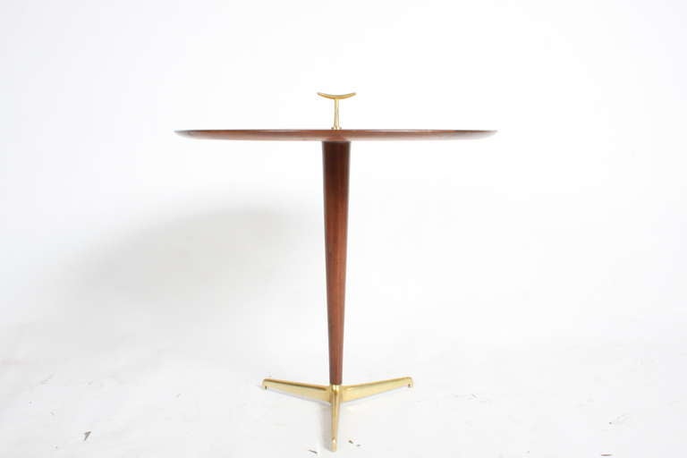 Edward Wormley for Dunbar Snack table with brass tripod legs and finial, Carpitian Elm top with mahogany edge and center post. Model number 4856, brass Dunbar label as well as paper label, Table height 32.25