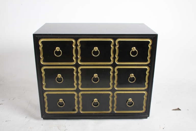 1950's lacquered chest of drawers by Dorothy Draper for Heritage. Incised drawer fronts in gold with brass hardware.