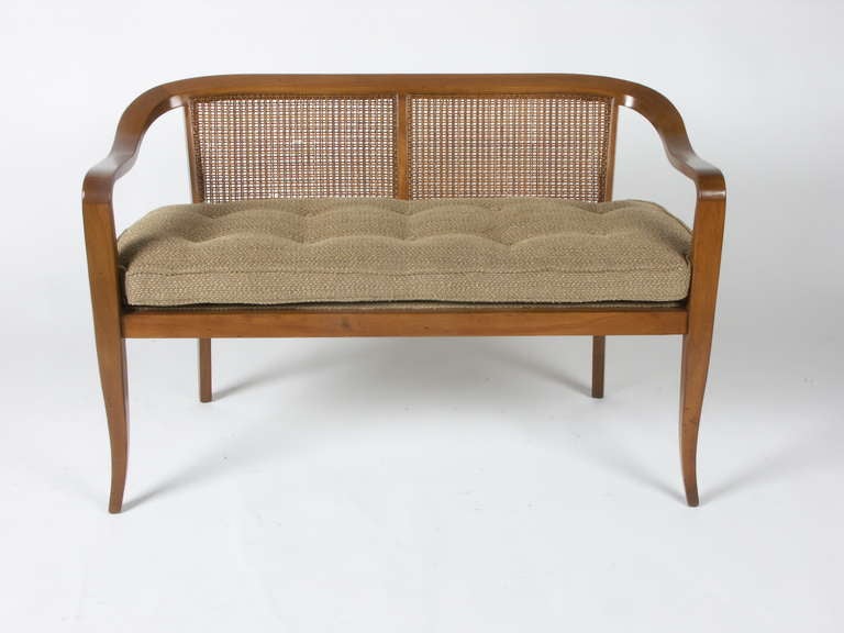cane back sette with tapered curved legs 