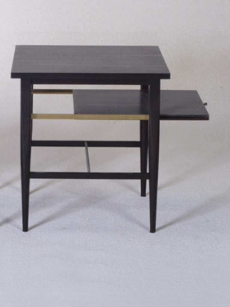 Paul McCobb end table or nightstand with pull-out shelf with brass knob in Philippine mahogany.