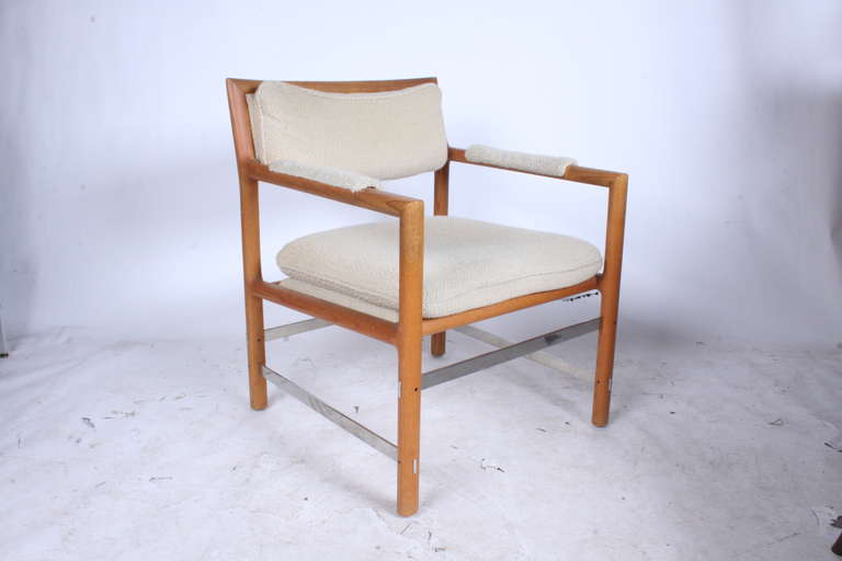 Mid-Century Modern Edward Wormley for Dunbar model #979 CH, Oiled ash frame with flat Aluminum bar cross stretchers, with upholstered arms back and seat. Paper label. Upholstery and foam should be updated. 