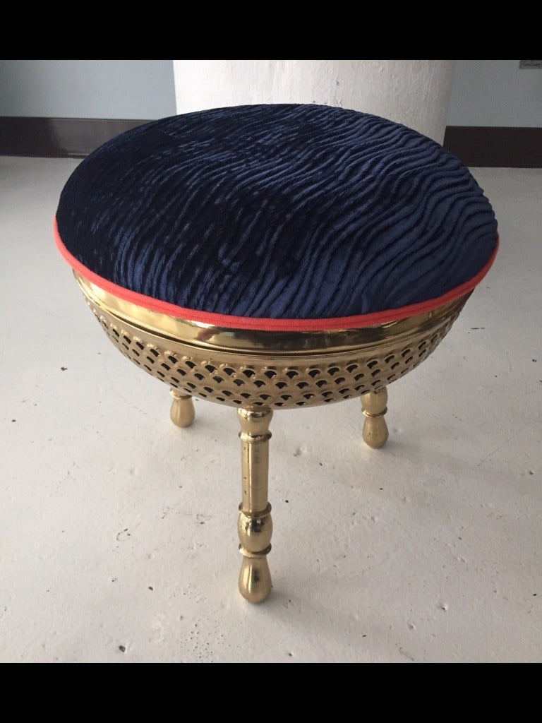 Pair of three-leg brass stools with pierced design below cushion. Updated in Mokum textured velvet with Houles Paris trim.