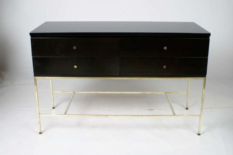 Directional line console by Paul McCobb, 4 drawers with a brass base