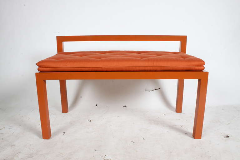Orange lacquered bench with parsons legs &  orange seat cushion