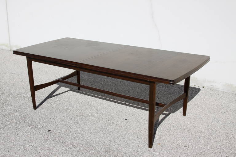 Mid-Century dining table. Measures: 84.5 L x 38.5 W x 28.75 H (without leaf) and 26