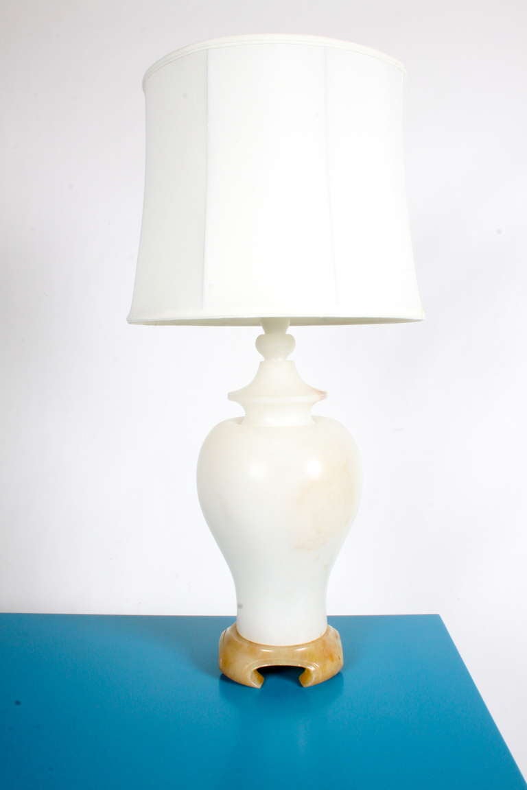 Mid-Century alabaster lamp with sculpted base, Lamp. Shade not included. 
Measures: 36 H x 17.5, with shade
36 H x 11 D.