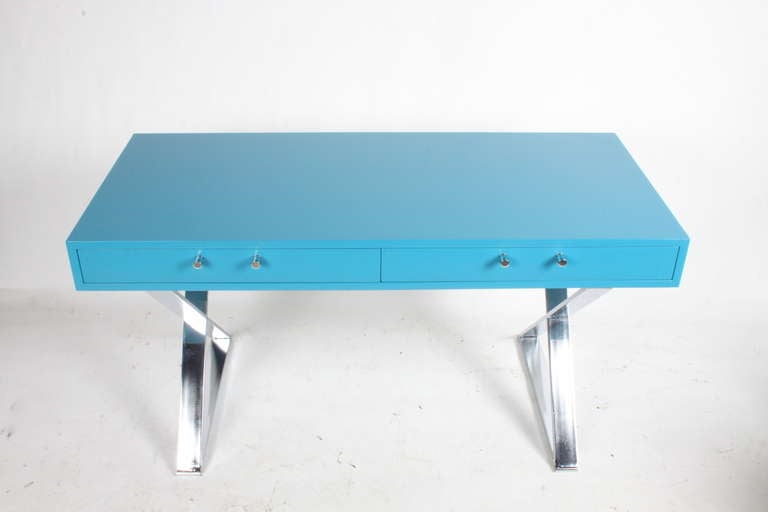 Milo Baughman desk with chrome X-base in blue lacquer, 54.25x 24.25x 28.5 H, made by Glen of California.