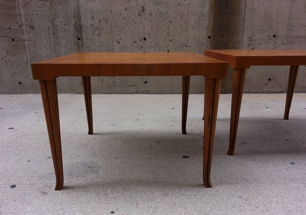 Pair of coffee or end tables by T. H. Robsjohn-Gibbings for Baker. Model number #742, labeled
Size – 24” x 24” x 18” H.
Condition: Original – solid frames, no chipped veneer, some sunfading, minor wear to finish – circular scratches to top and one