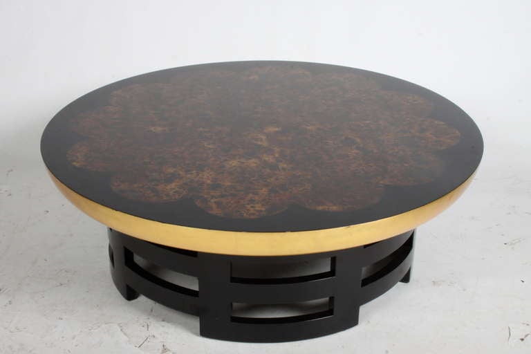 Lacquered top cocktail table with tortoise lacquer center, gold leaf on top edge and black lacquered Asian Modern base. Designed by Theodore Mueller & Isabel Barringer, circa 1948.