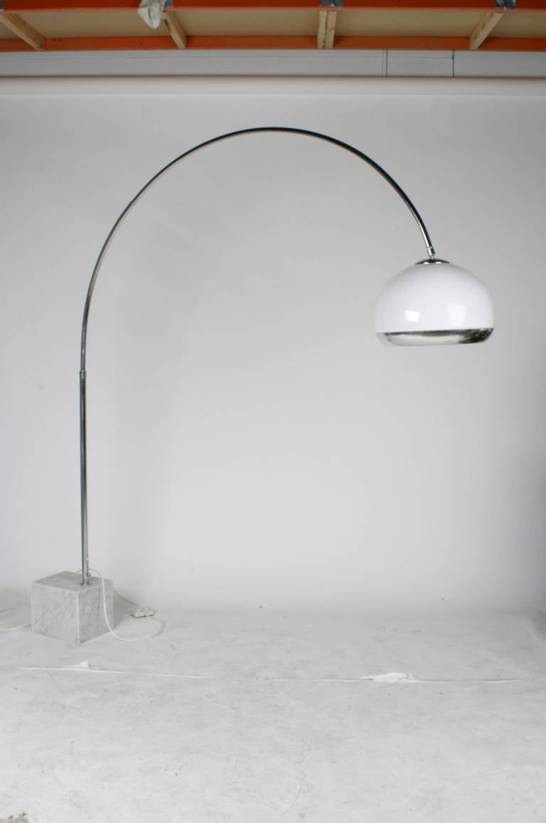 Harvey Guzzini floor lamp with chrome arc support, white globe that has internal light as well as a center bulb.