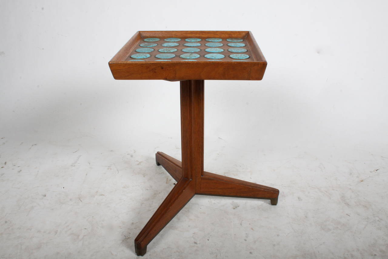 Rare Janus side table with 25 inset tiles by Otto and Gertrud Natzler. Designed by Edward Wormley for Dunbar. Base of walnut with brass edging on legs.