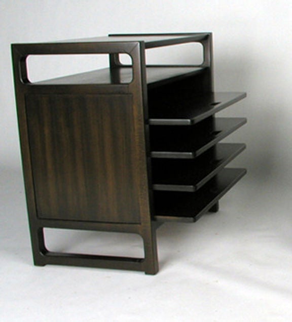 Edward Wormley for Drexel magazine tables with four pull-out shelves below an open shelf. Dark brown finish on silver elm. 