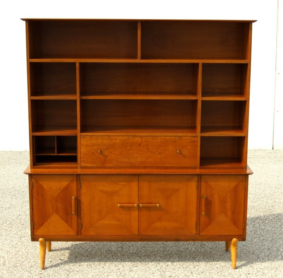 Renzo Rutili for Johnson Furniture Cherry wood sideboard with storage hutch. Center bar/serving cabinet folds down, cabinet doors on bottom, Divider box shown on left side is removeable and can fit in the other storage spaces.