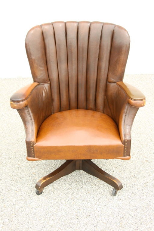 Oversized Desk chair with original worn in leather, on casters
