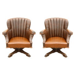 Pair of oversized Vintage Leather  swivel reception chairs