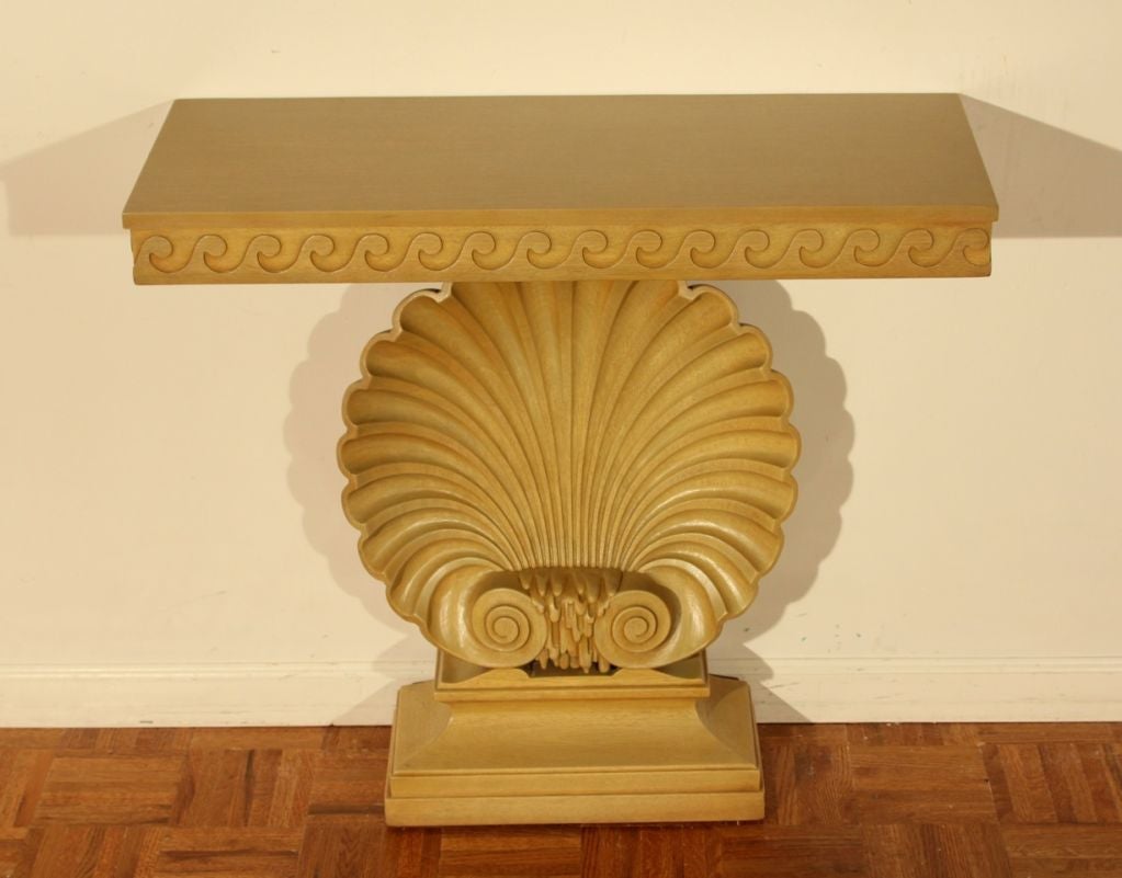 Early example of Edward Wormley's work for Dunbar, circa 1941, bleached mahogany hand-carved shell with wave detail around top (pair available-price is for one).