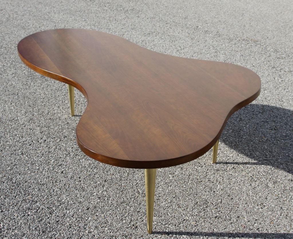 Biomorphic Cherry wood Gibbings cocktail table, similar in shape to his Mesa table, Early version of this design for Widdicomb with thicker tapered brass legs